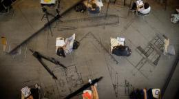 Aerial view of a socially-distanced classroom set up, with engineering design tools interspersed